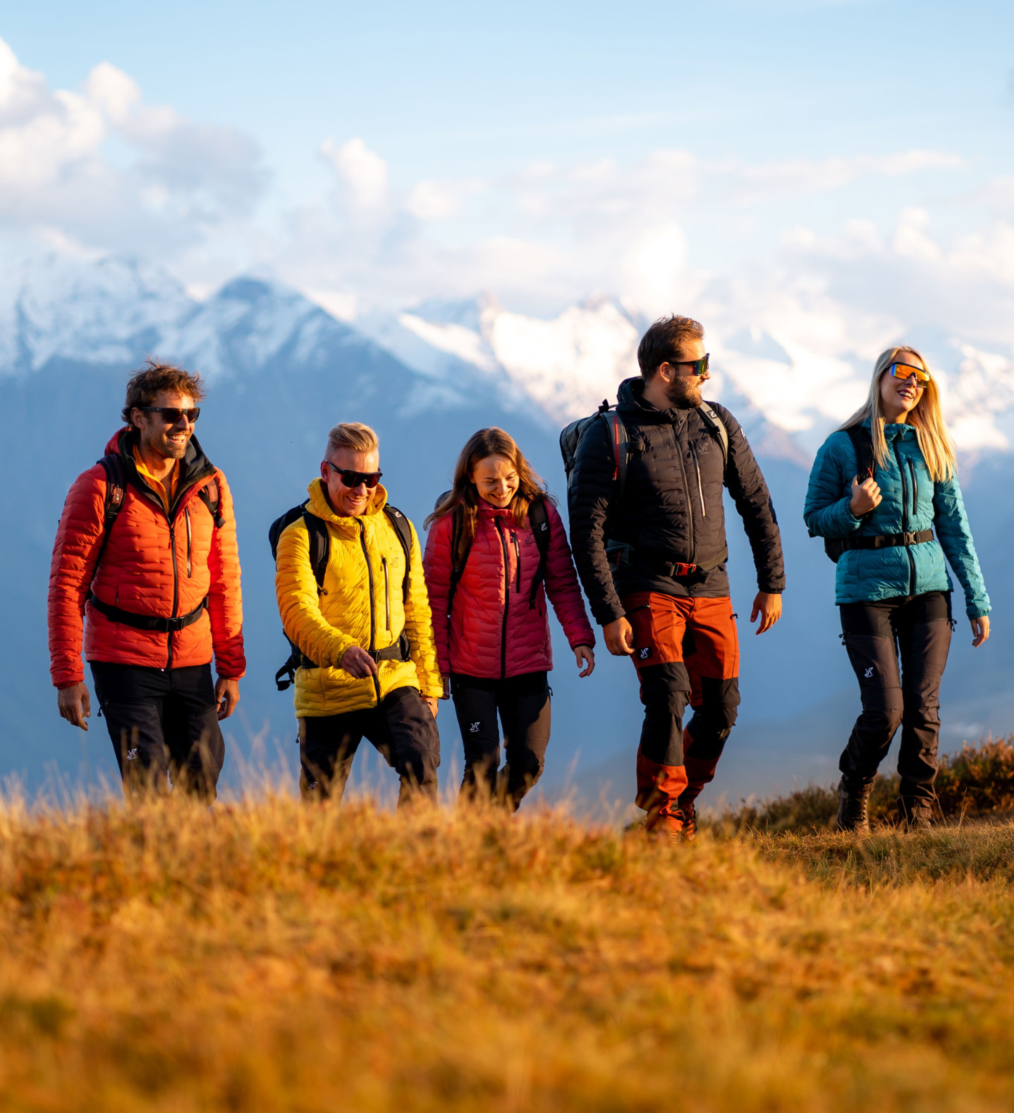 Colorful hikers in the alps with Flex Down Jacket